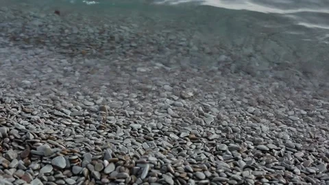 Sea waves roll on the pebble beach. The concept of nature, ecology, water re Stock Footage 165201044