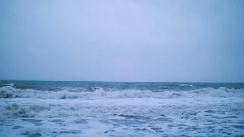 The sea waves roll to the shore Stock Footage 74488351