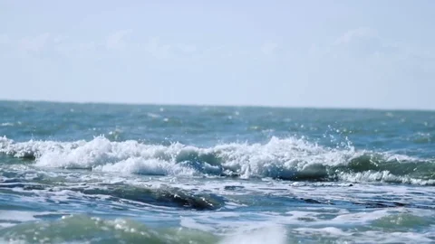The sea waves roll to the shore Stock Footage 74493296
