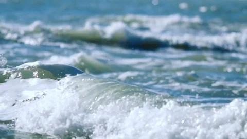 The sea waves roll to the shore Stock Footage 74493363