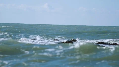 The sea waves roll to the shore Stock Footage 74493792