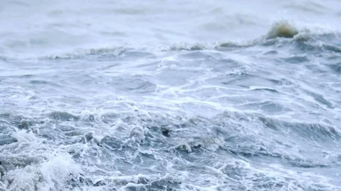 The sea waves roll to the shore Stock Footage 74494928