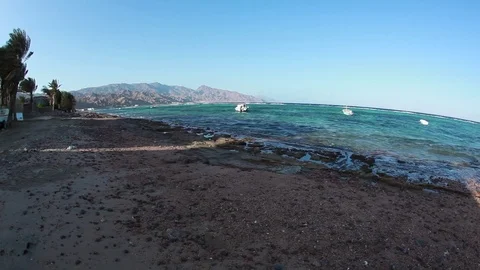 Sea waves rolling over stones on the beach. Red Sea. Stock Footage 82685553