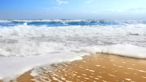 Sea waves rolling on a sandy beach. Sea foam movement. Stock Footage 91249979