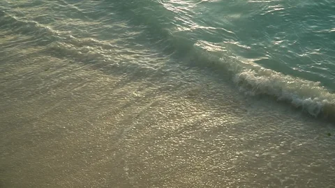 Sea Waves Rolling On Sandy Beach At Sunset Stock Footage 107427342