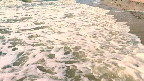 Sea waves rolling on a sandy beach on the seashore on summer sunny day Stock Footage 284339127