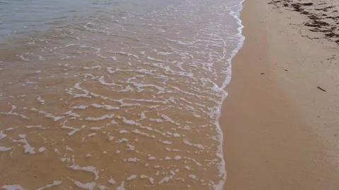 Sea waves rolling onto a sandy beach 库存影片 340559690