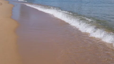 Sea waves rolling onto a sandy beach Stock Footage 340620843