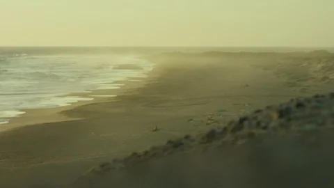 Sea waves rolling towards beach at sunset Stock Footage 106323329