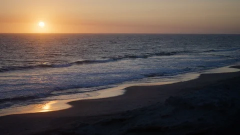 Sea waves rolling towards beach at sunset Stock Footage 106504463