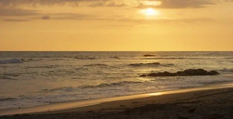 Sea waves rolling towards beach at sunset Stock Footage 107013515