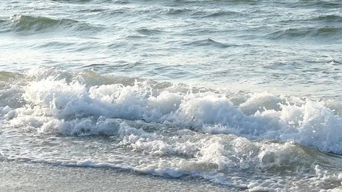 Sea waves run ashore slow motion Stock Footage 122945366