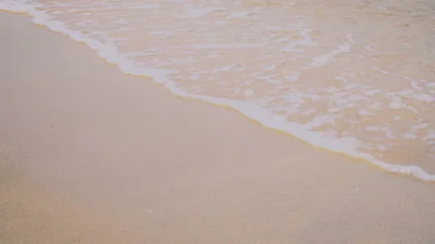 Sea waves on the sand close-up Stock Footage 87418916