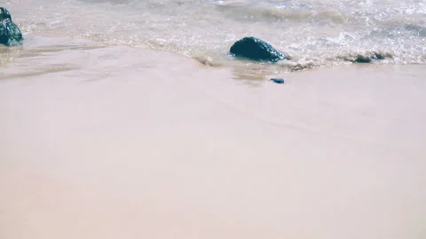 Sea waves on the sand close-up Slow motion Stock Footage 87305927