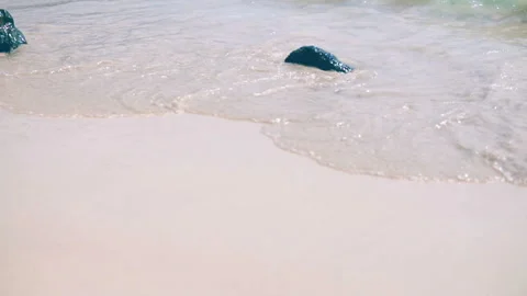 Sea waves on the sand close-up Slow motion Stock Footage 87305948