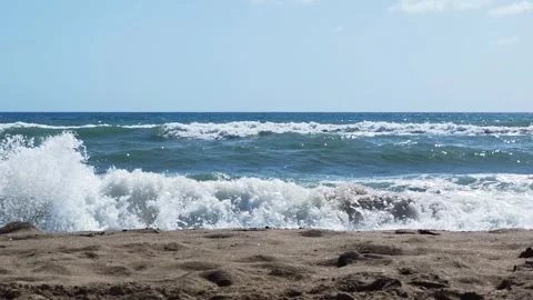 Sea waves on a sandy beach Video stock 257219345