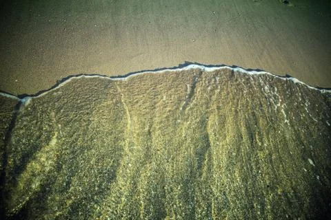 Sea waves on a sandy beach. Stock Photos
