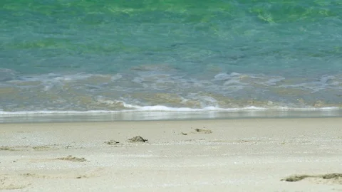 Sea waves on sandy beach. Slow motion. Sea waves of transparent water on Video stock 93220911