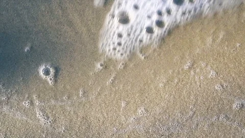 Sea waves on a sandy beach at a windy sunny day. Stock Footage 100607440