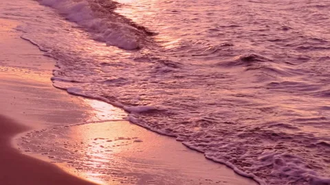 Sea waves with shiny reflection of beautiful pink gold sunset light.ProRes 422HQ Stock Footage 247921578