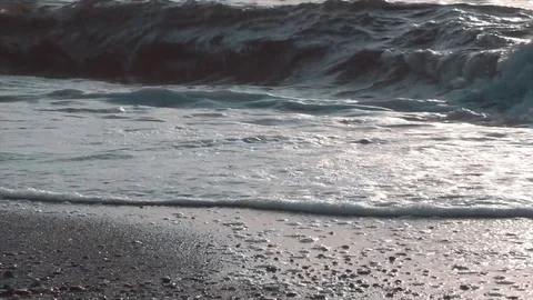 Sea waves on shore, beach. Washed ashore water and foam with sand. Stock Footage 112270636