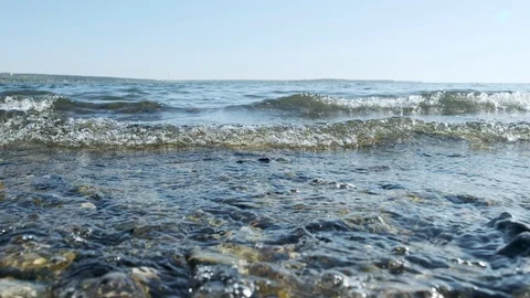 Sea waves on the shore, close-up. Clear water in the sea, natural marine oceanic Stock Footage 119908142