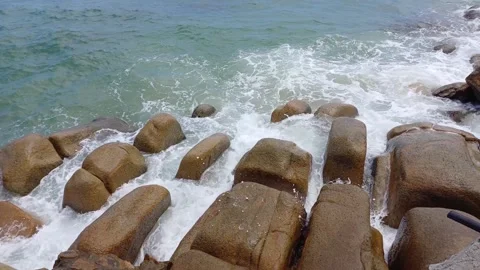 Sea waves splash and foam on the rocks  of Ca Na beach, Vietnam. Stock Footage 252158251