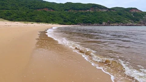 Sea waves splashing on beach sand. Summer seascape. Beautiful tropical beach Stock Footage 336703427