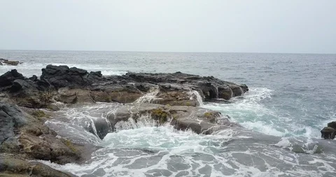 Sea waves splashing on the rocks Stock Footage 96464974