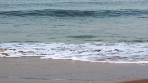 Sea waves splashing on a sandy beach Stock Footage 126843452