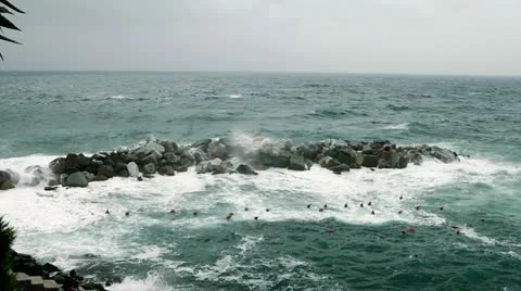 Sea waves splashing through a gap in the rocks. Stock Footage 22244606