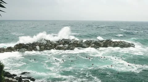 Sea waves splashing through a gap in the rocks. Stock Footage 22244650