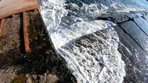 Sea waves on a stone pier Stock Footage 144840399