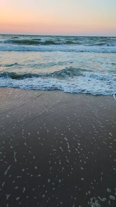 Sea waves storm beach sand sky dawn Natural background Vertical Stock Footage 296420233