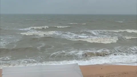 Sea waves storm empty beach clouds gray sky nature Stock Footage 219376569