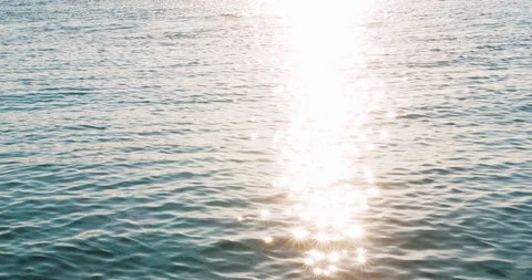 Sea waves with sun lights star and sky reflection in summer day. Blue Video stock 112801582