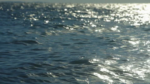 Sea waves with sunrays Stockbeeldmateriaal 212688328