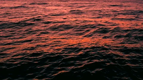 Sea waves of the sunset with light reflection by the beach, slow motion, hd. Stock Footage 237520458