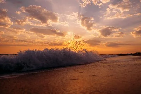 Sea waves at sunset. Stock Photos