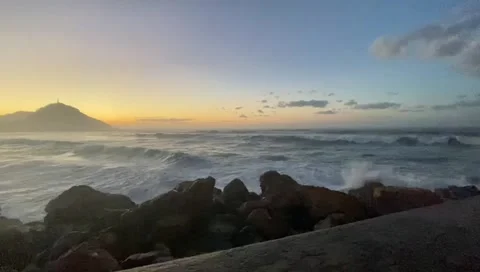 Sea waves, sunset, rocks. Stock Footage 147609892