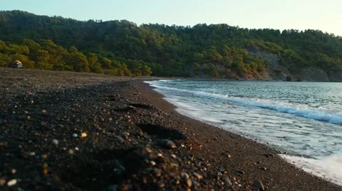 Sea waves at sunset at Turkish Mediterranean sea lagoon Stock Footage 59777023