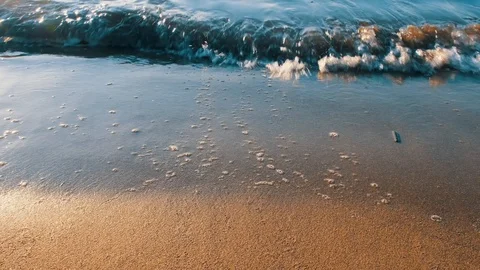 Sea waves at sunset.4k. slowmotion Stock Footage 125182618