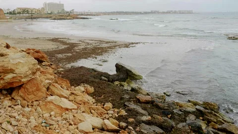 Sea Waves Surging Over Natural Coastal Rock Formations Видео 345006920