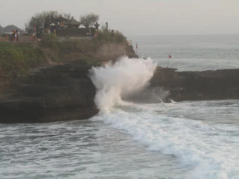 Sea ​​waves at Tanah Lot Temple when it's cloudy Stock Photos