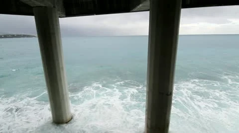 Sea waves under the bridge - close up Stock Footage 21244927