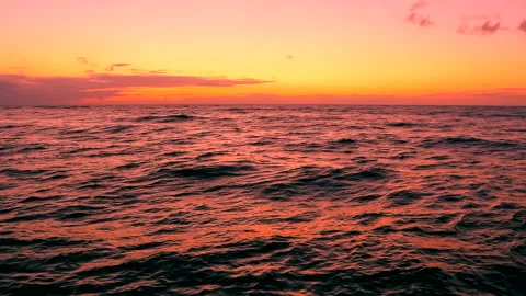 Sea waves with view the sunset with light reflection by the beach, panning. Stock Footage 237520088