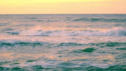 Sea waves with view the sunset with light reflection by the beach, slow motion. Stock Footage 237814818