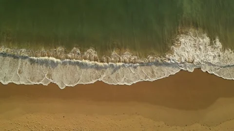 Sea waves wash over a sandy beach Stock Footage 317564132