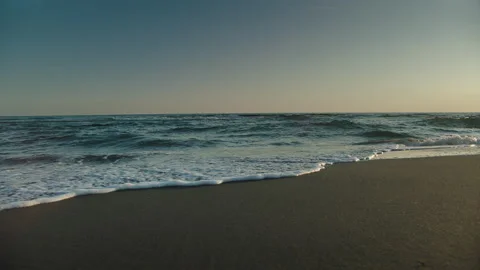 Sea waves washing empty sandy beach Stock Footage 155898696
