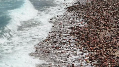 Sea waves washing over pebble beach Stock Footage 341840282